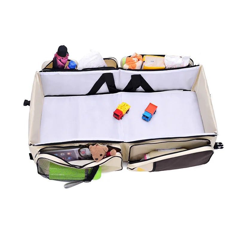 Večnamenska torba in potovalna posteljica za dojenčke
